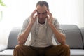 Man On Sofa Having Headache. Royalty Free Stock Photo
