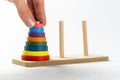 Man solving a tower of Hanoi moving elements with his hand, puzzle recursive algorithm computer science problems abstract, object Royalty Free Stock Photo