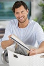 man sorting laundry in basket Royalty Free Stock Photo