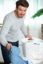 man sorting laundry in basket Royalty Free Stock Photo