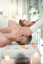 Man, spa and bed for luxury massage to relax, breathe and zen on vacation, holiday or hotel with woman. Couple