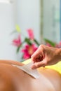 Man in Spa getting back waxed for hair removal Royalty Free Stock Photo