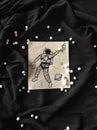 A man is in spacesuit dowing art and background with pearls