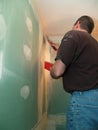 Man spackling new drywall Royalty Free Stock Photo