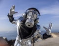 man with sparkling gas mask dancing by the sea