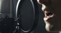 Man speaking into a microphone studio Royalty Free Stock Photo
