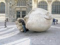 Man speaking to stone sculpture