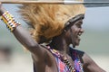 Maasai man, warrior, male lion mane on head, spear in hand, Tanzania