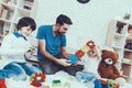 Father and Sons is Playing with Toys Royalty Free Stock Photo