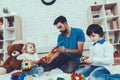 Father and Sons is Playing with Toys Royalty Free Stock Photo