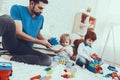 Father and Sons is Playing with Toys Royalty Free Stock Photo