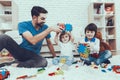 Father and Sons is Playing with Toys Royalty Free Stock Photo