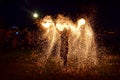 Man spinning and throwing a lot of sparks