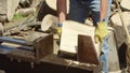 Man splitting tree blocks with Hydraulic wood splitter.