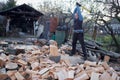 Man splitting wood with axe and maul