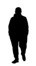 Man in sport wear walking the street vector silhouette illustration. Boy with hands in pockets in sweat suit and sneakers.