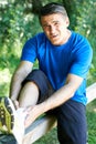 Man With Sports Injury Sustained Whilst Exercising Outdoors Royalty Free Stock Photo