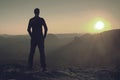 Man sports jerzey enjoy summit  triumph. Hiker watch the  Sun Royalty Free Stock Photo