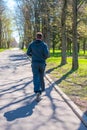 Man in a sports suit running in city park Royalty Free Stock Photo