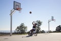 Man in sports wheelchair throwing basketball Royalty Free Stock Photo