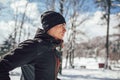 Man Taking Break From Running in Extreme Snow Conditions