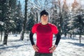 Man Taking Break From Running in Extreme Snow Conditions