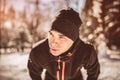 Man Taking Break From Running in Extreme Snow Conditions