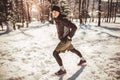 Man Taking Break From Running in Extreme Snow Conditions