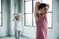 Man sporty and hijab woman doing stretching before core exercise Royalty Free Stock Photo