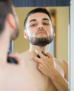 Man spraying fragrance perfume Royalty Free Stock Photo