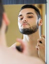 Man spraying fragrance perfume Royalty Free Stock Photo