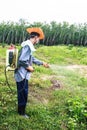 A man is spraying herbicide