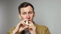 Man sprays nasal medication into nostrils to get relief Royalty Free Stock Photo