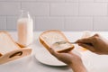 Man spreading butter on slice of bread, closeup Royalty Free Stock Photo