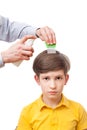 Man is sprinkling child head by anti-nits spray Royalty Free Stock Photo