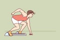 Man sprinter prepares for race at running standing in starting position in sports stadium Royalty Free Stock Photo