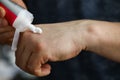 Man squeezes cream on his hand to moisturize skin Royalty Free Stock Photo