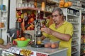 Man squeezes and sells fresh juice
