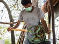 The man is squeezing juice from sugar cane. Using manual Mechanism for that Royalty Free Stock Photo