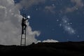 Man on stairs with bright stars at night Royalty Free Stock Photo