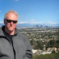 Older man on top of Los Angeles overlook Royalty Free Stock Photo