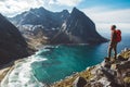 Man stand on cliff edge alone enjoying aerial view backpacking lifestyle travel adventure outdoor vacations Royalty Free Stock Photo