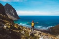 Man stand on cliff edge alone enjoying aerial view backpacking lifestyle travel adventure outdoor vacations Royalty Free Stock Photo