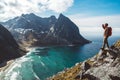 Man stand on cliff edge alone enjoying aerial view backpacking lifestyle travel adventure outdoor vacations Royalty Free Stock Photo