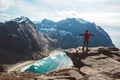 Man stand on cliff edge alone enjoying aerial view backpacking lifestyle travel adventure outdoor vacations Royalty Free Stock Photo