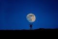 Man stand at full moon Royalty Free Stock Photo
