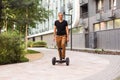 man stand near segway hoverboard Royalty Free Stock Photo