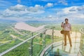 The man stand at Thai skywalk, beautiful sky and cloud at Mekong river, international border between Nong Khai Province, hailand