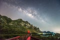 A man standing against milky way and mountain, Thailand