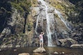 Man standing against waterfall Royalty Free Stock Photo